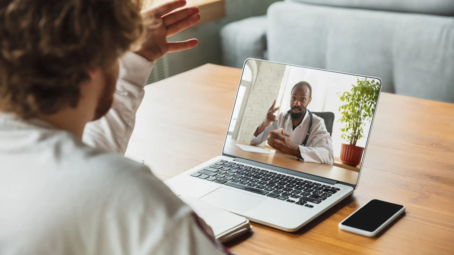 businessman-student-working-from-home-being-isolated-keep-quarantine-cause-coronavirus-caucasian-man-using-laptop-tablet-phone-headphones-online-conference-lesson-remote-office